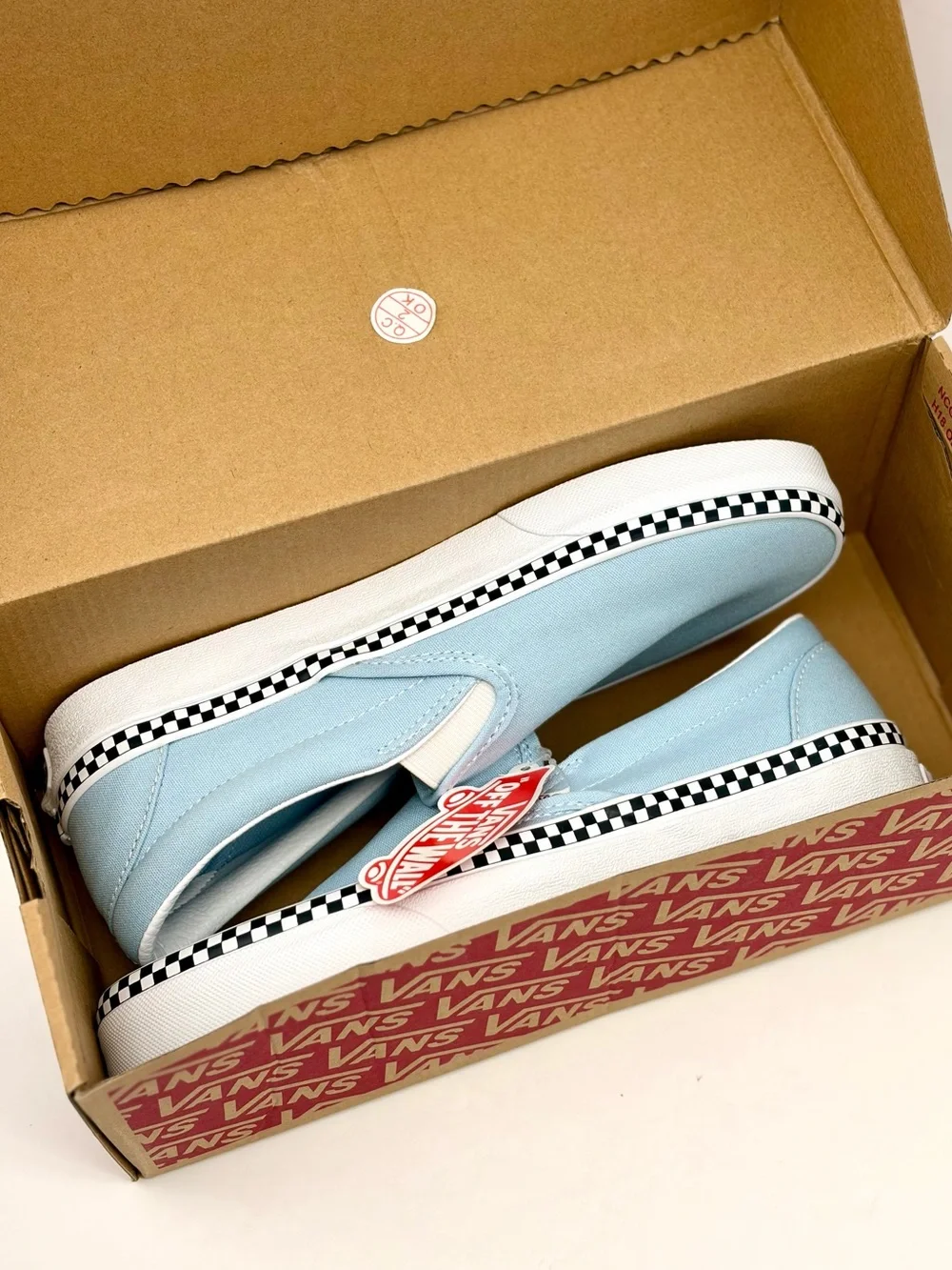 Vans Slip-On Sneakers in Light Blue with Checkerboard Trim